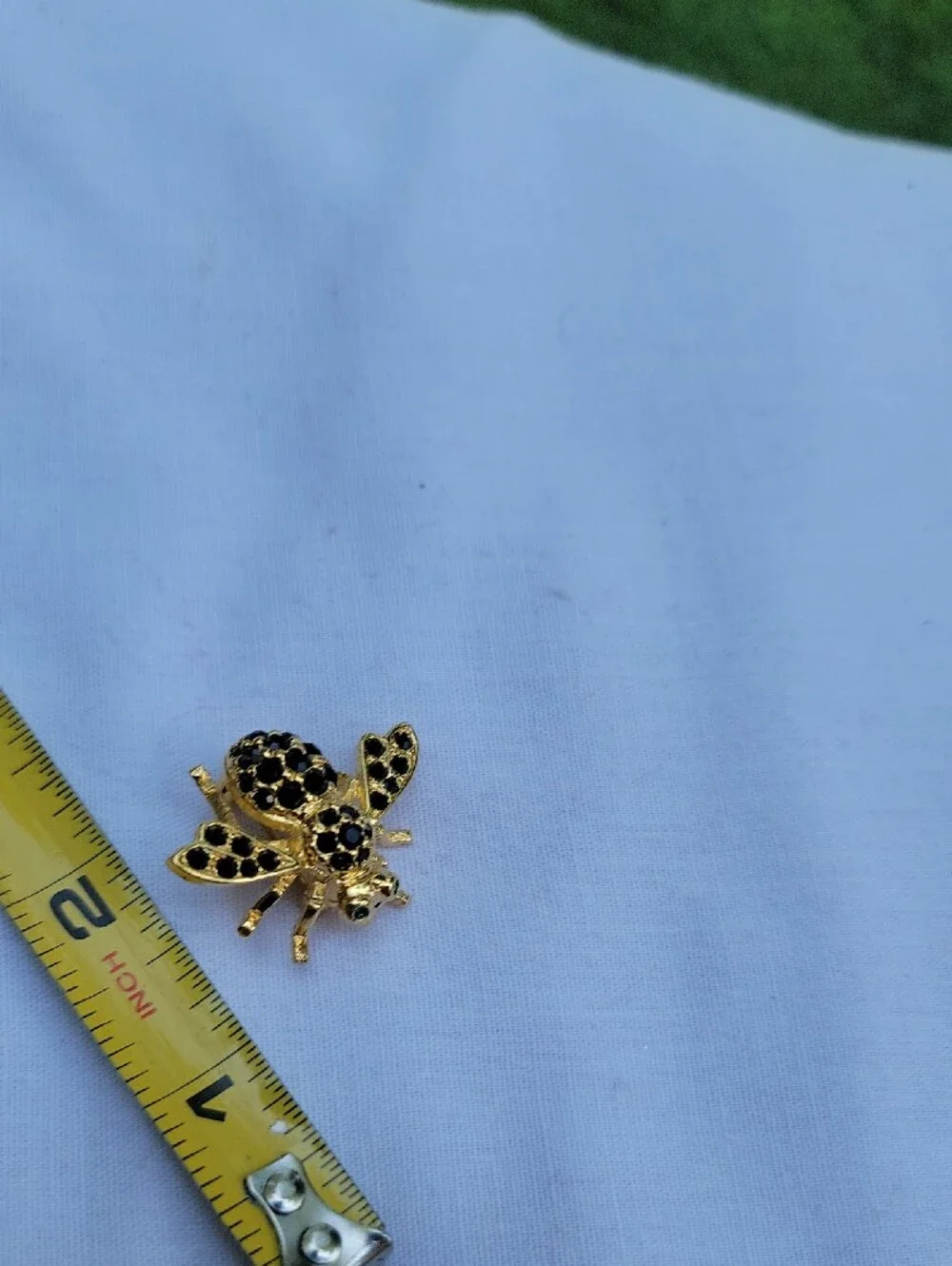 Vintage Joan Rivers Gold Bee Brooch with Black Accents Green Eyes